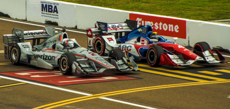Josef Newgarden and Conor Daly race on to pit lane.